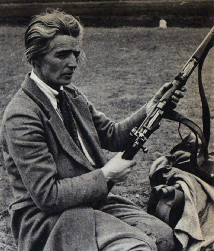 Marjorie competing for the King's Prize in 1939. This photograph shows her having just set the sights of her rifle for elevation and wind velocity, the picture appeared in 'Picture Post' in 1939.